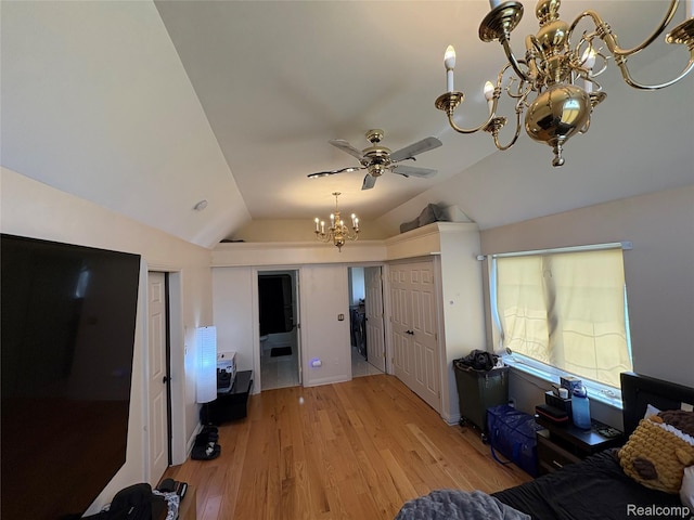3351 Reid Rd, Swartz Creek, MI 48473 - living area with a chandelier, lofted ceiling, light wood-type flooring, and ceiling fan