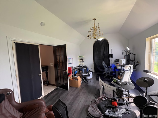 3351 Reid Rd, Swartz Creek, MI 48473 - playroom with lofted ceiling, wood finished floors, and a chandelier