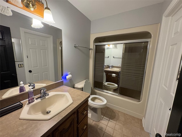 3351 Reid Rd, Swartz Creek, MI 48473 - bathroom featuring vanity, bath / shower combo with glass door, and tile patterned flooring