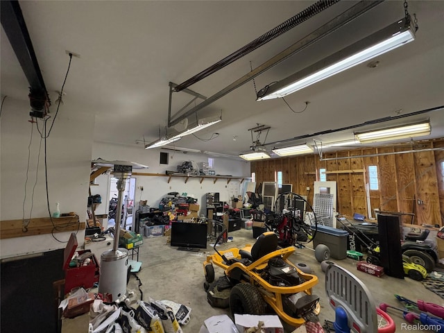 3351 Reid Rd, Swartz Creek, MI 48473 - garage featuring wooden walls and a workshop area