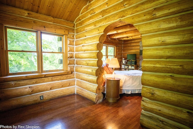 4585 W Arrowhead Dr, White Cloud, MI 49349 - bedroom featuring dark wood-style flooring, wooden ceiling, and arched walkways