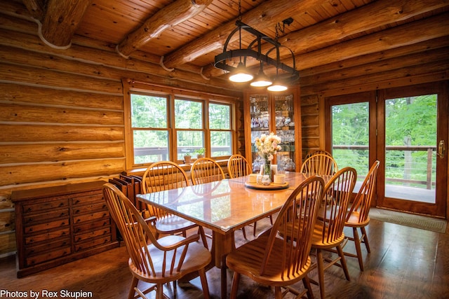 4585 W Arrowhead Dr, White Cloud, MI 49349 - dining space featuring a wood ceiling with exposed beams, healthy amount of natural light, hardwood / wood-style floors, and rustic walls