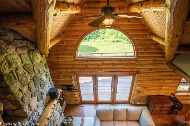 4585 W Arrowhead Dr, White Cloud, MI 49349 - living room with ceiling fan, log walls, wood finished floors, and a wooden ceiling with exposed beams
