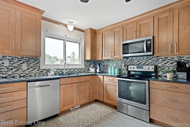 438 Oakgrove Ct, Clawson, MI 48017 - kitchen featuring appliances with stainless steel finishes, decorative backsplash, and dark stone counters