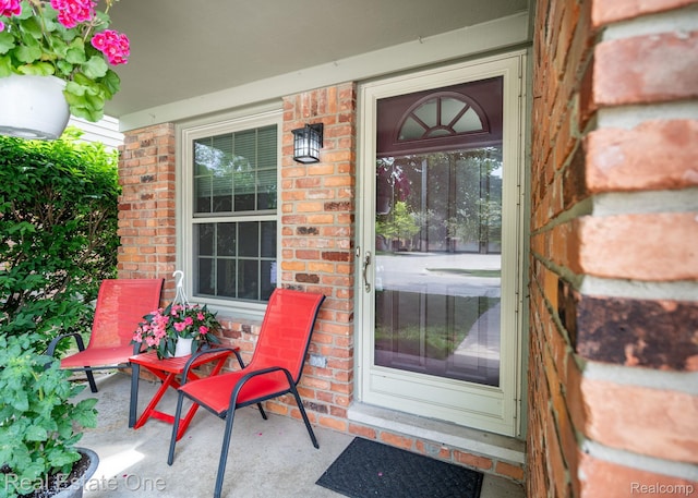 438 Oakgrove Ct, Clawson, MI 48017 - doorway to property with brick siding and covered porch
