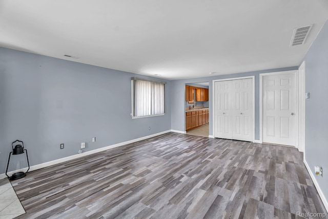 5941 Ziegler St, Taylor, MI 48180 - unfurnished bedroom featuring wood finished floors and a closet