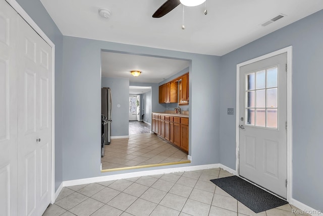 5941 Ziegler St, Taylor, MI 48180 - foyer entrance featuring a ceiling fan and light tile patterned flooring