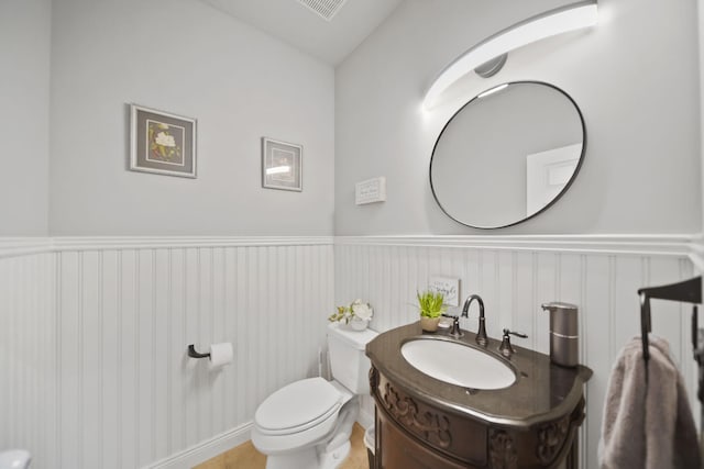 874 Pinecrest, Dexter, MI 48130 - half bathroom featuring wainscoting, vanity, and a decorative wall