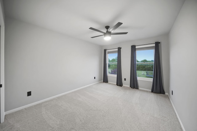 874 Pinecrest, Dexter, MI 48130 - unfurnished room with ceiling fan and light colored carpet