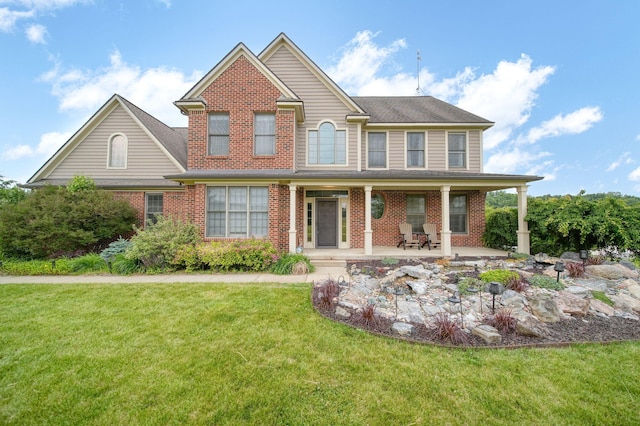 874 Pinecrest, Dexter, MI 48130 - view of front of home featuring brick siding and a front yard