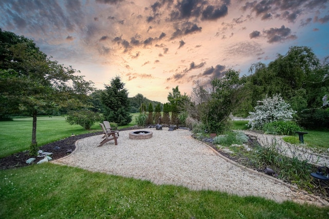 874 Pinecrest, Dexter, MI 48130 - view of grassy yard featuring a fire pit and a patio