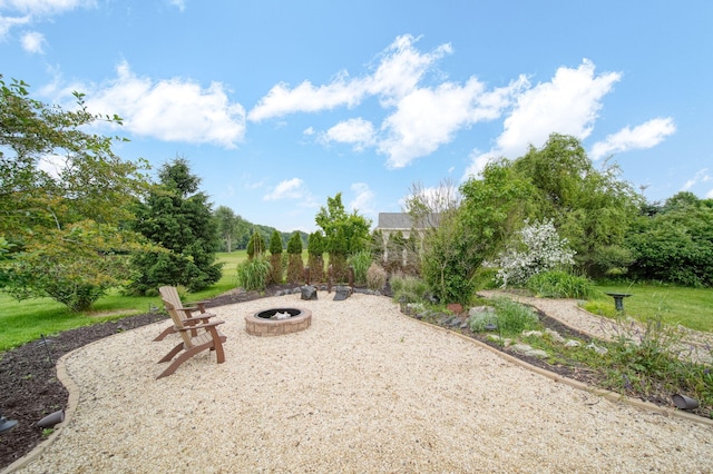874 Pinecrest, Dexter, MI 48130 - view of yard with a fire pit