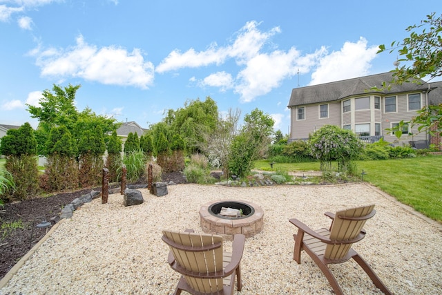 874 Pinecrest, Dexter, MI 48130 - view of grassy yard featuring a fire pit