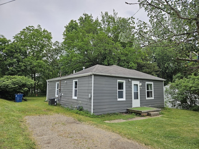 1406 Bixby Rd, Kalamazoo, MI 49048 - view of front of house featuring a front lawn and view of scattered trees