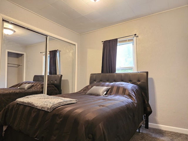 1406 Bixby Rd, Kalamazoo, MI 49048 - bedroom with carpet floors, a closet, and ornamental molding