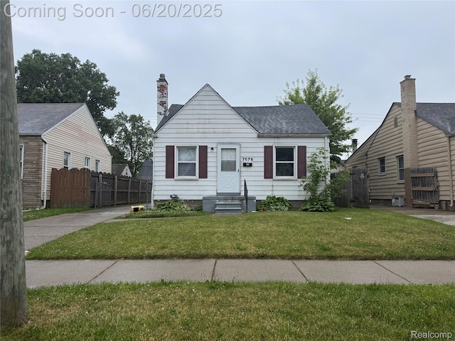 7576 Wood Ave, Warren, MI 48091 - bungalow-style home featuring a chimney and a shingled roof