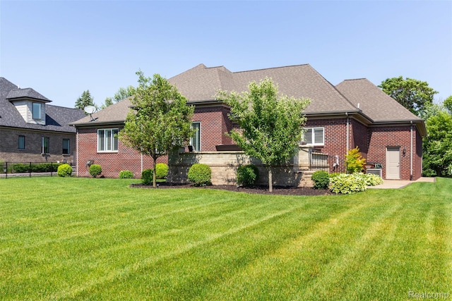 48913 Pinebrook Dr, Utica, MI 48315 - view of front facade with brick siding and roof with shingles