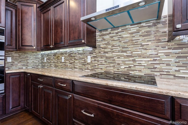 48913 Pinebrook Dr, Utica, MI 48315 - kitchen featuring range hood, decorative backsplash, and dark brown cabinetry