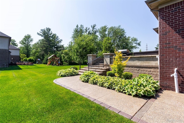 48913 Pinebrook Dr, Utica, MI 48315 - view of grassy yard with a playground