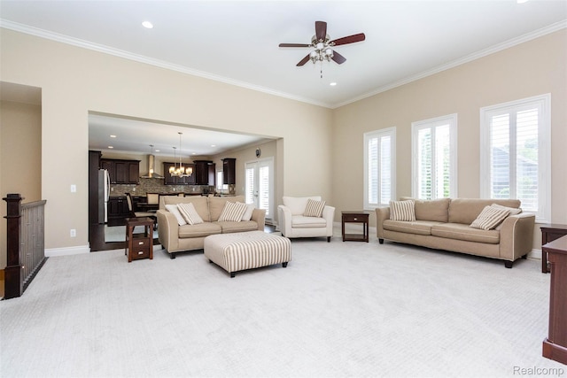 48913 Pinebrook Dr, Utica, MI 48315 - living room featuring light colored carpet, crown molding, a chandelier, a ceiling fan, and recessed lighting