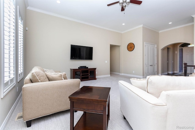 48913 Pinebrook Dr, Utica, MI 48315 - living area featuring arched walkways, ceiling fan, recessed lighting, ornamental molding, and carpet