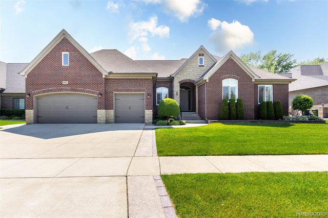 48913 Pinebrook Dr, Utica, MI 48315 - view of front facade featuring driveway, stone siding, brick siding, and a front lawn