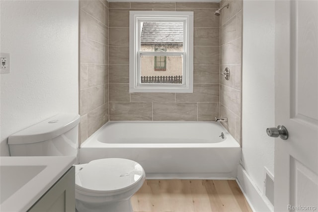 12719 Sussex St, Detroit, MI 48227 - bathroom featuring vanity, wood finished floors, shower / washtub combination, and a textured wall