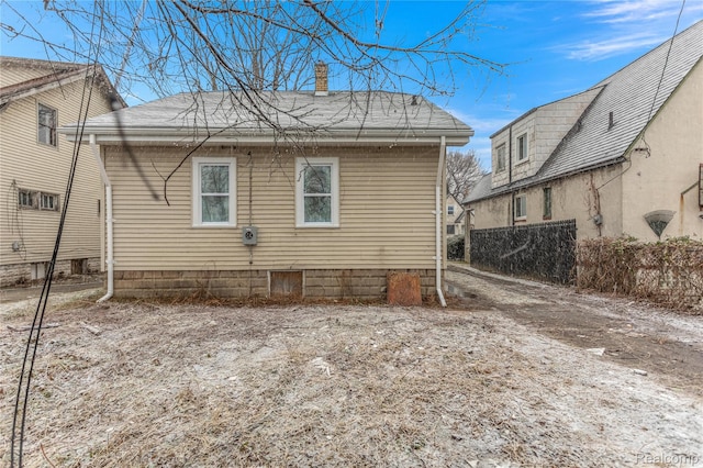 12719 Sussex St, Detroit, MI 48227 - back of house featuring a chimney