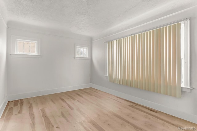 12719 Sussex St, Detroit, MI 48227 - unfurnished room featuring a textured ceiling and wood finished floors