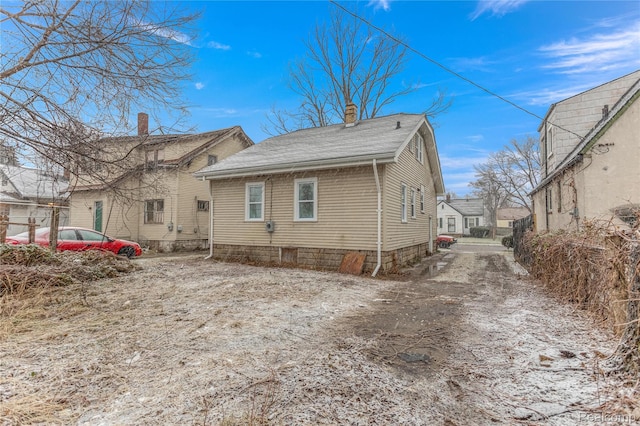 12719 Sussex St, Detroit, MI 48227 - view of side of property featuring a chimney