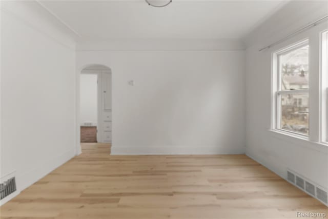 12719 Sussex St, Detroit, MI 48227 - unfurnished room featuring light wood-style flooring and arched walkways