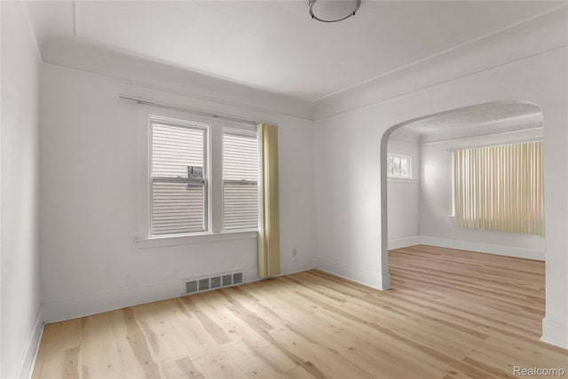 12719 Sussex St, Detroit, MI 48227 - unfurnished room featuring arched walkways and wood finished floors