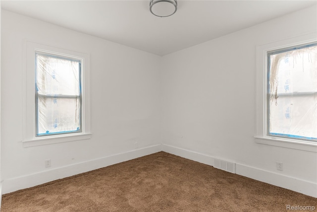 12719 Sussex St, Detroit, MI 48227 - empty room with carpet and plenty of natural light