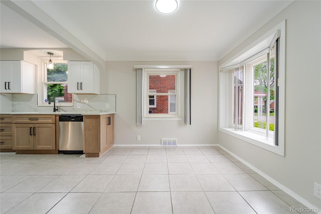 15648 Stricker Ave, Sterling Heights, MI 48021 - kitchen with dishwasher and light tile patterned floors