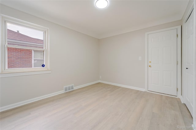 15648 Stricker Ave, Sterling Heights, MI 48021 - spare room featuring light wood-style flooring and baseboards