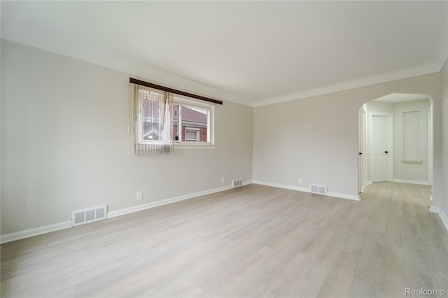 15648 Stricker Ave, Sterling Heights, MI 48021 - unfurnished room with arched walkways and light wood-style flooring