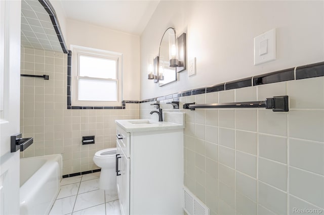 15648 Stricker Ave, Sterling Heights, MI 48021 - full bath with vanity, tile walls, a tub, and wainscoting