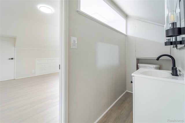 15648 Stricker Ave, Sterling Heights, MI 48021 - bathroom featuring wood finished floors and vanity