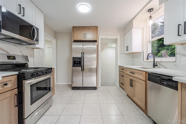 15648 Stricker Ave, Sterling Heights, MI 48021 - kitchen featuring appliances with stainless steel finishes, light countertops, and light tile patterned floors