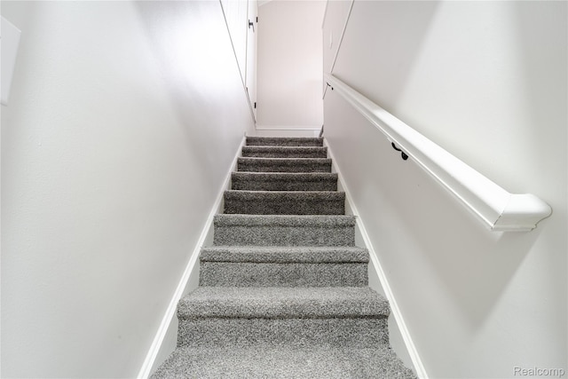 15648 Stricker Ave, Sterling Heights, MI 48021 - staircase featuring carpet floors and baseboards
