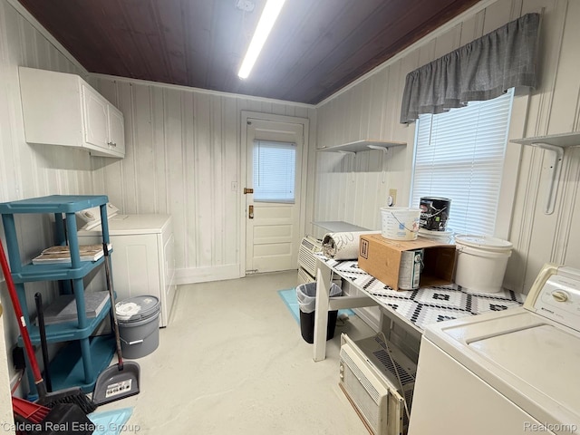 1149 E Milton Ave, Hazel Park, MI 48030 - laundry area featuring cabinet space, washer and dryer, wood ceiling, and wooden walls