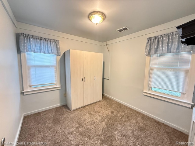 1149 E Milton Ave, Hazel Park, MI 48030 - unfurnished bedroom featuring carpet flooring and a closet