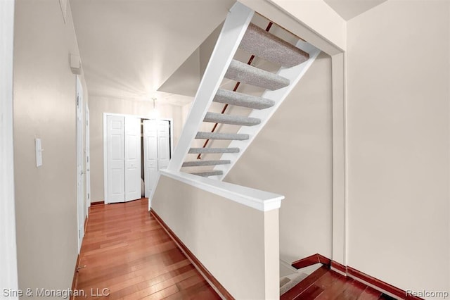 773 Kirts Blvd, Troy, MI 48084 - stairs featuring hardwood / wood-style flooring and baseboards