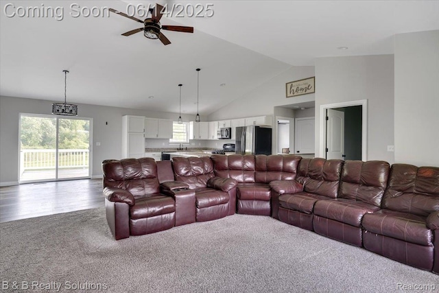 453 Angle Rd, Lapeer, MI 48446 - carpeted living room with a ceiling fan and high vaulted ceiling