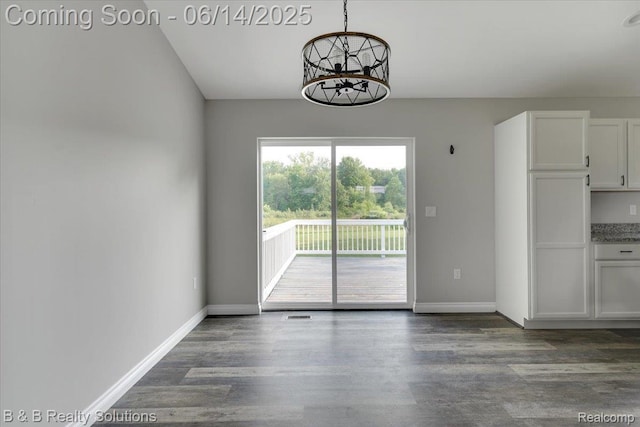 453 Angle Rd, Lapeer, MI 48446 - unfurnished dining area with dark wood-style floors and baseboards