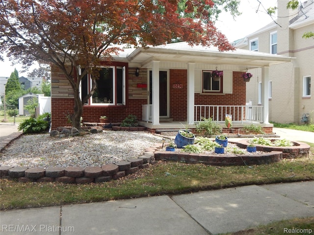 15274 Regina Ave, Allen Park, MI 48101 - bungalow with brick siding and a porch