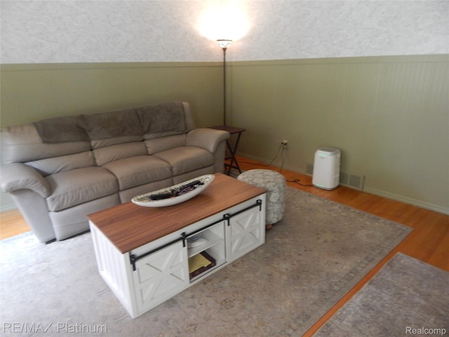 15274 Regina Ave, Allen Park, MI 48101 - living area featuring a wainscoted wall, light wood-type flooring, and wallpapered walls