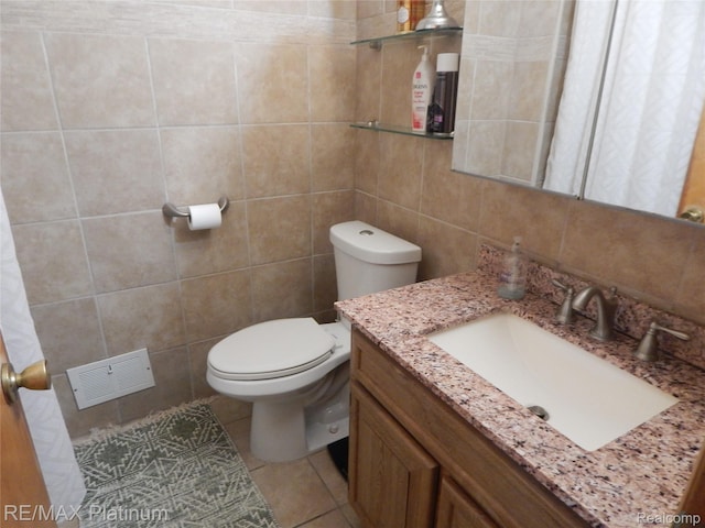 15274 Regina Ave, Allen Park, MI 48101 - bathroom with tile walls, vanity, and tile patterned flooring