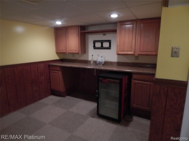 15274 Regina Ave, Allen Park, MI 48101 - bar with a wainscoted wall, wine cooler, light flooring, recessed lighting, and wooden walls