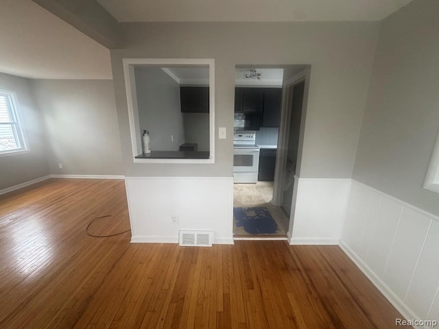 248 W Longfellow Ave, Pontiac, MI 48340 - empty room with wood finished floors and wainscoting